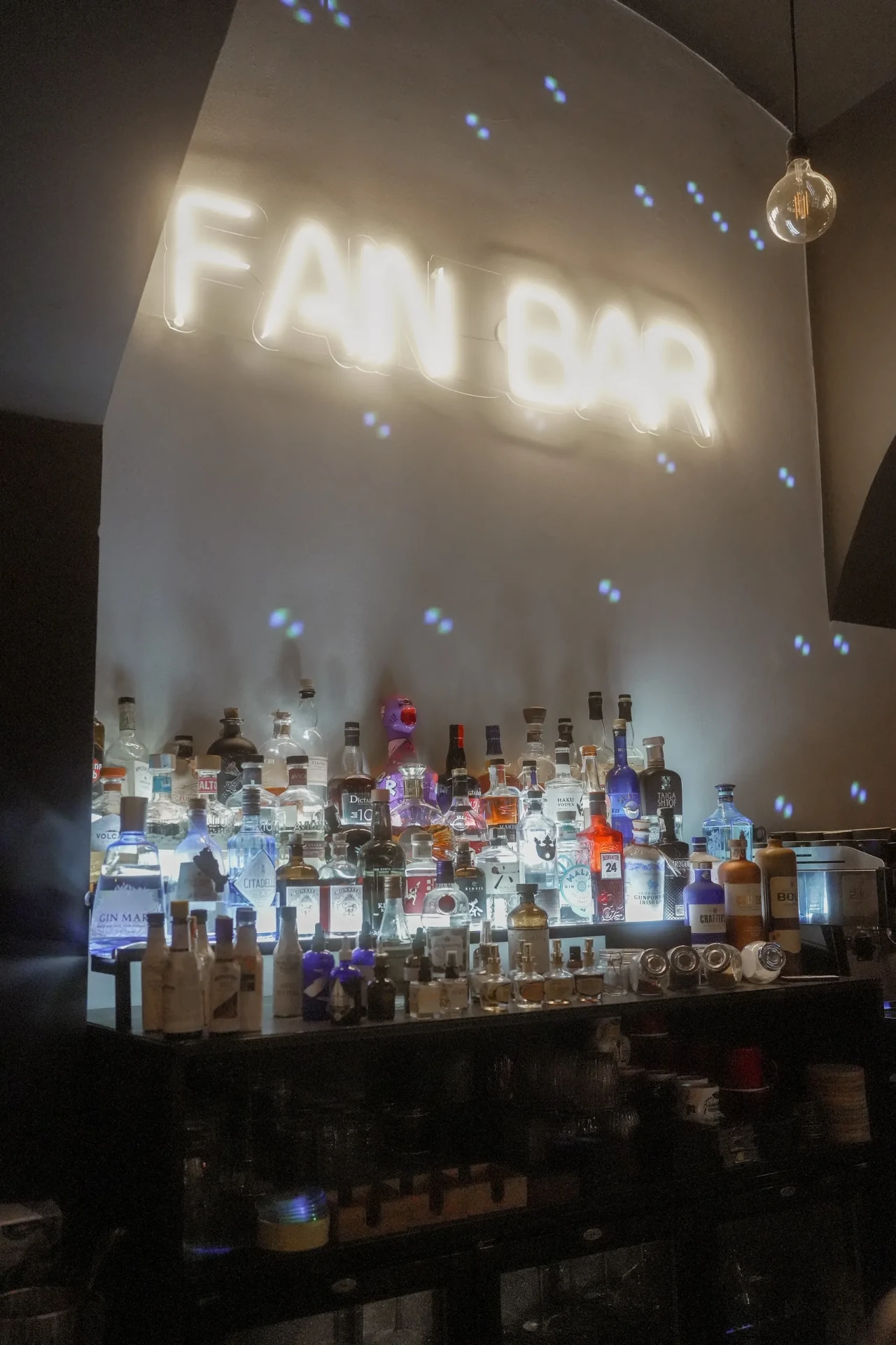 Atmospheric commercial photograph of the illuminated FAM Bar
