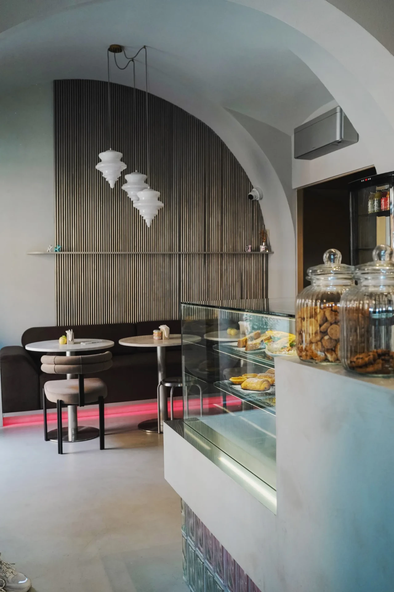 Commercial interior photograph of a modern café and pastry counter